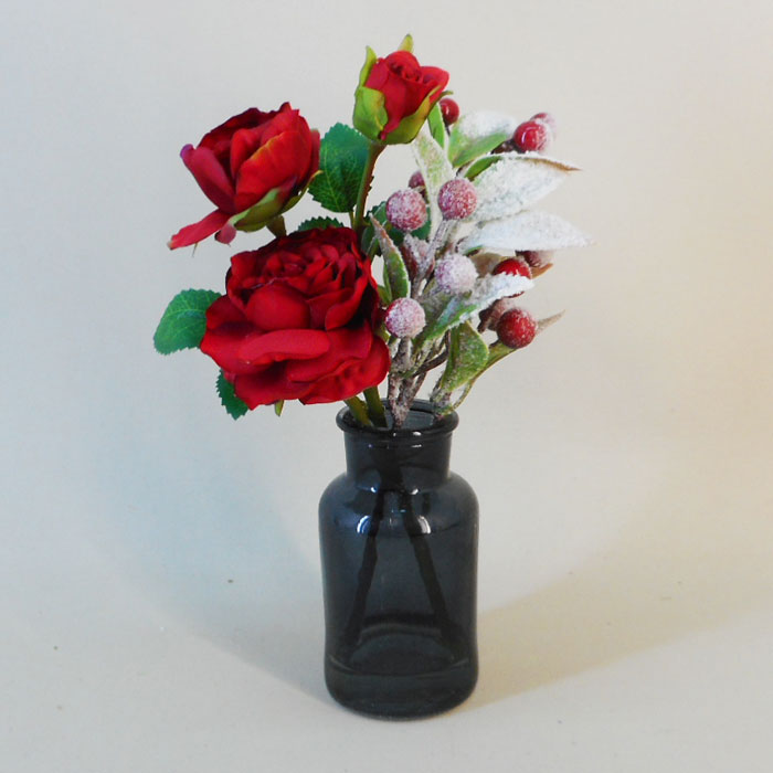 Red artificial top flowers in vase